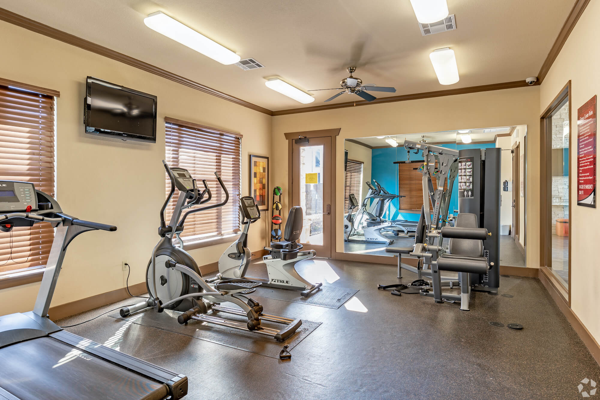 A gym full of exercise equipment.